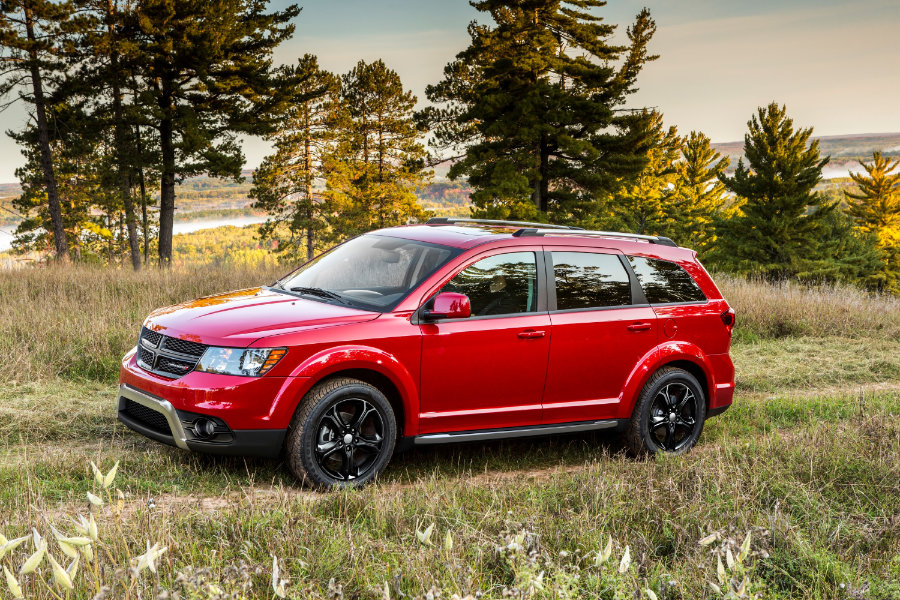 Profile view of pre-owned red Dodge Journey near Canada