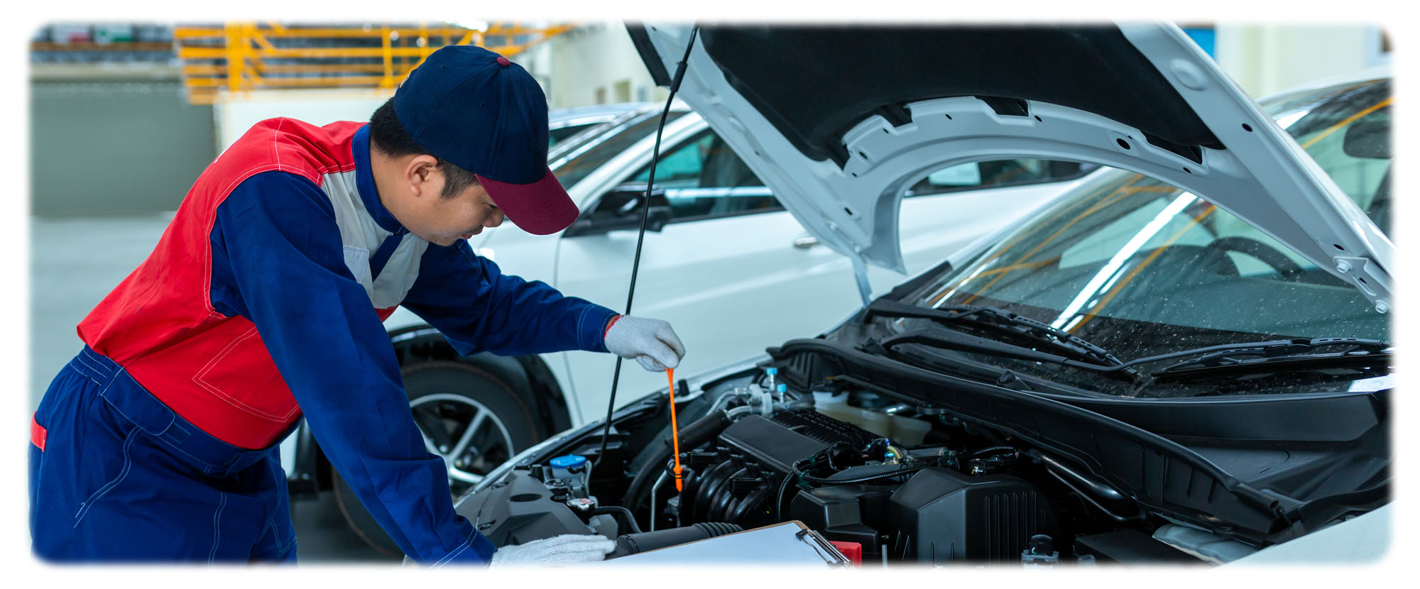 Man performing CPO Canada certified warranty repair on car engine