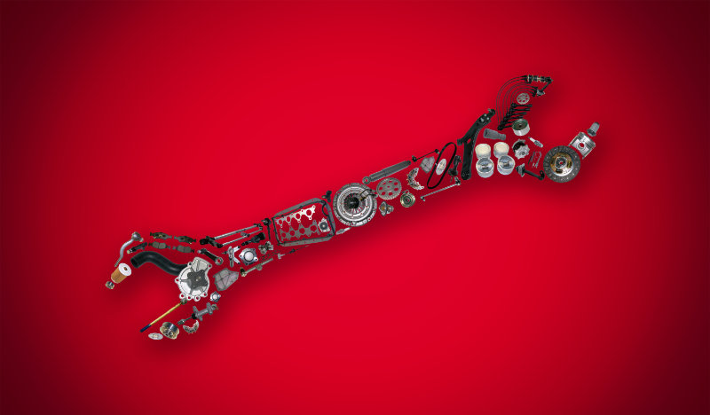 Wrench on red background