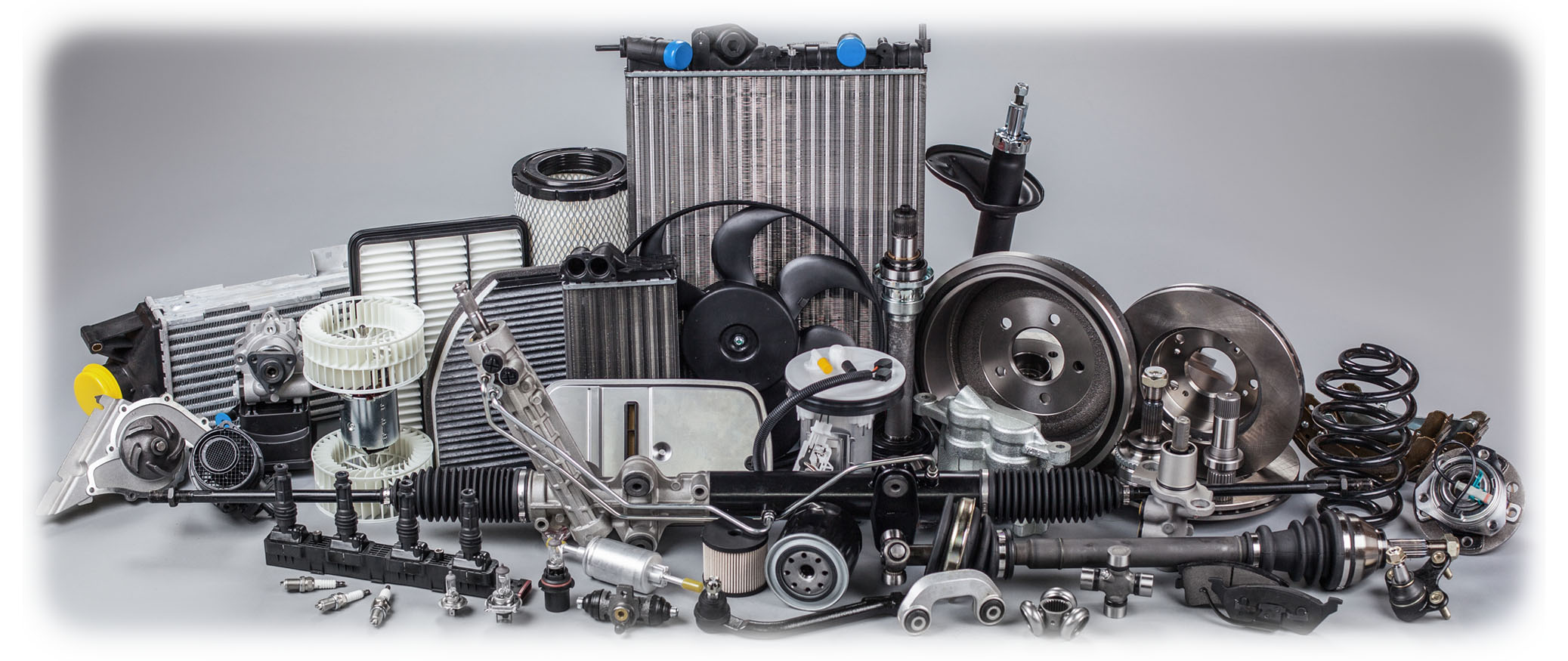 Various car parts laid out against dark gray background