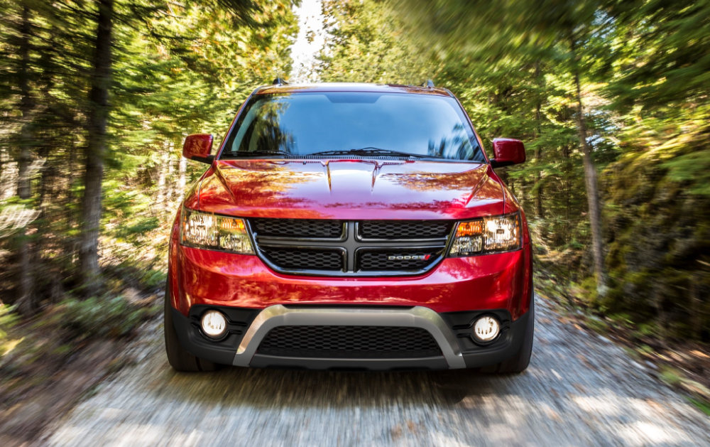 Red Dodge Journey in Canadian forest